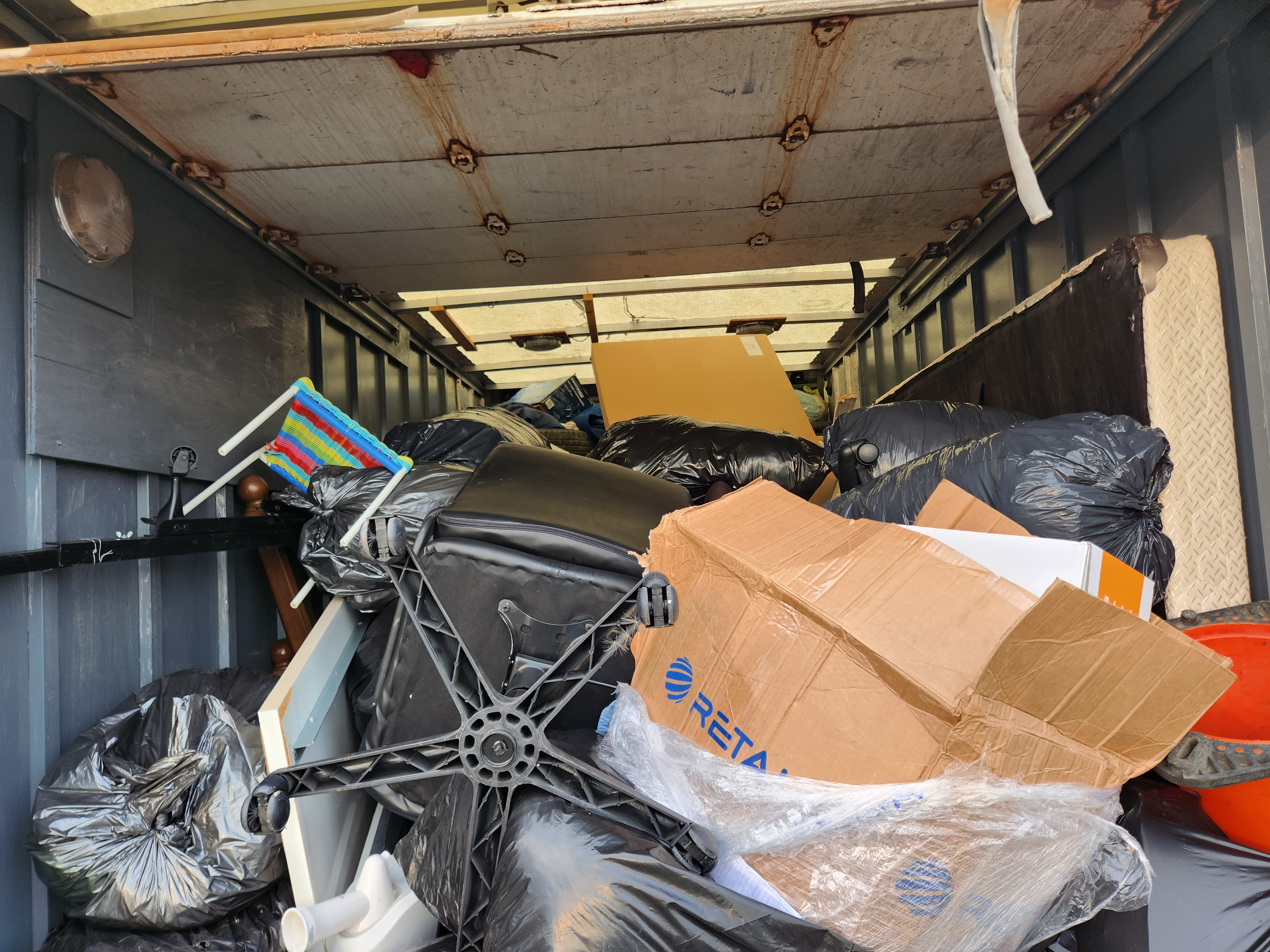 Cargo Van Logistics truck packed and ready for a move in Calgary