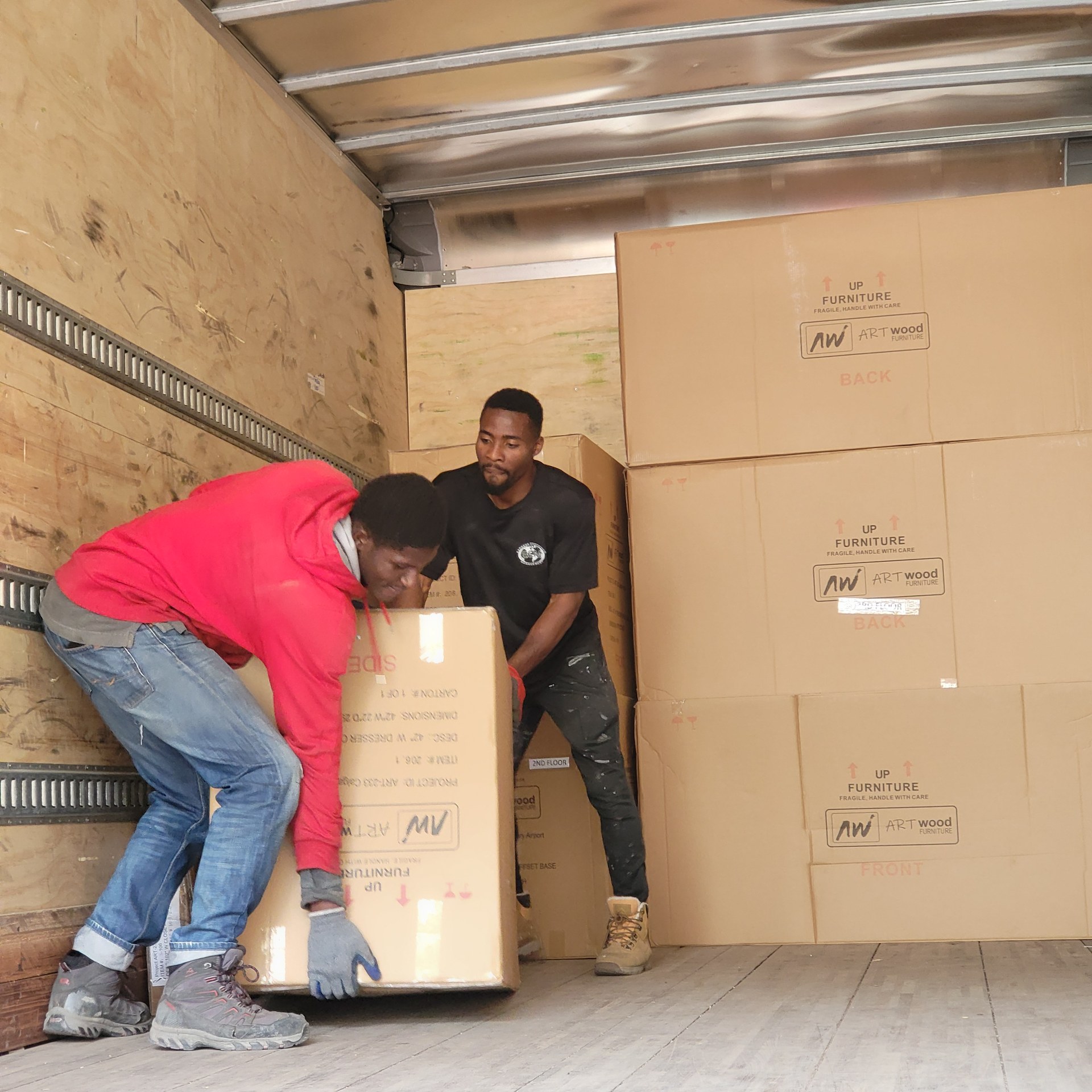 Cargo Van Logistics crew carefully handling furniture