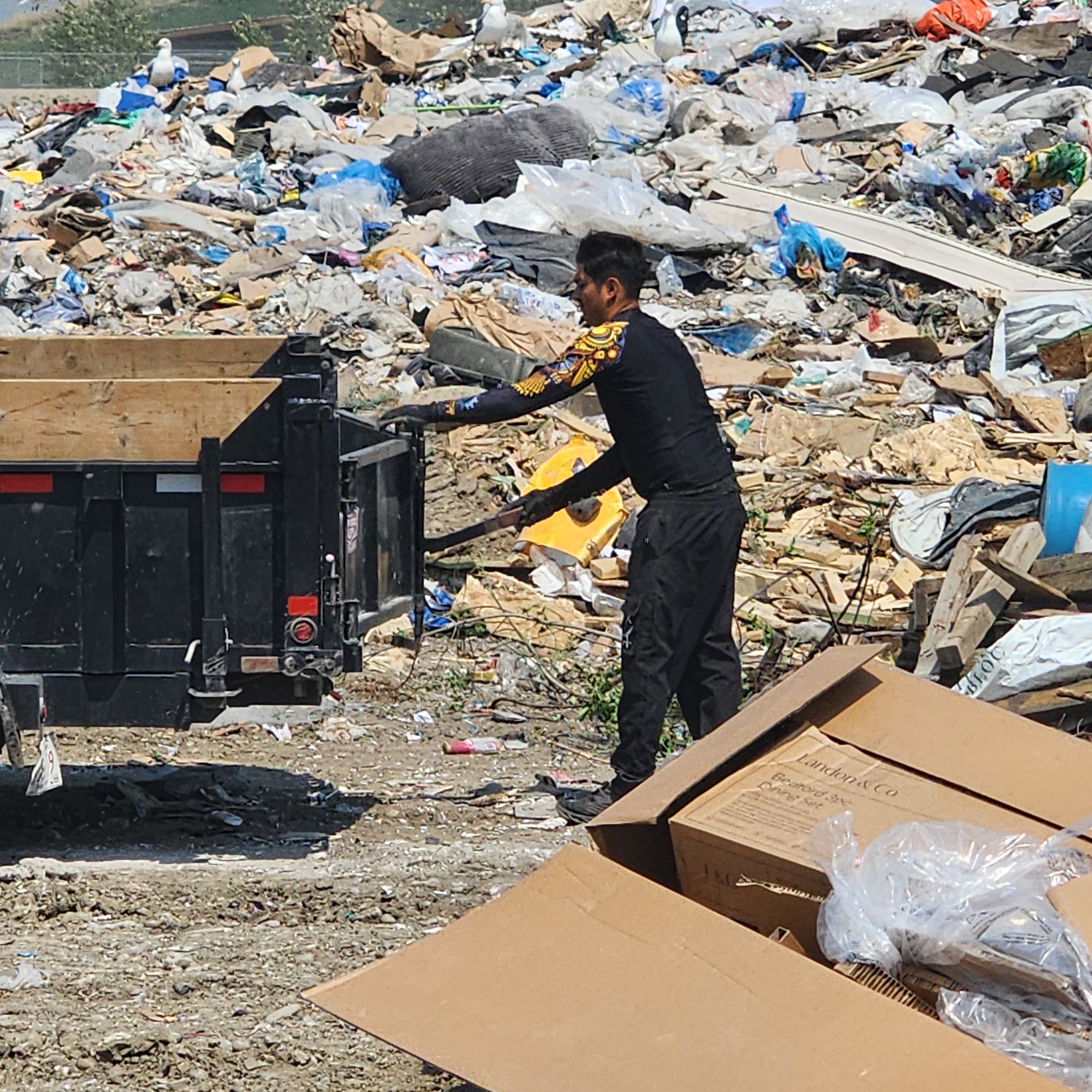 Cargo Van Logistics garbage disposal truck loaded with junk removal items